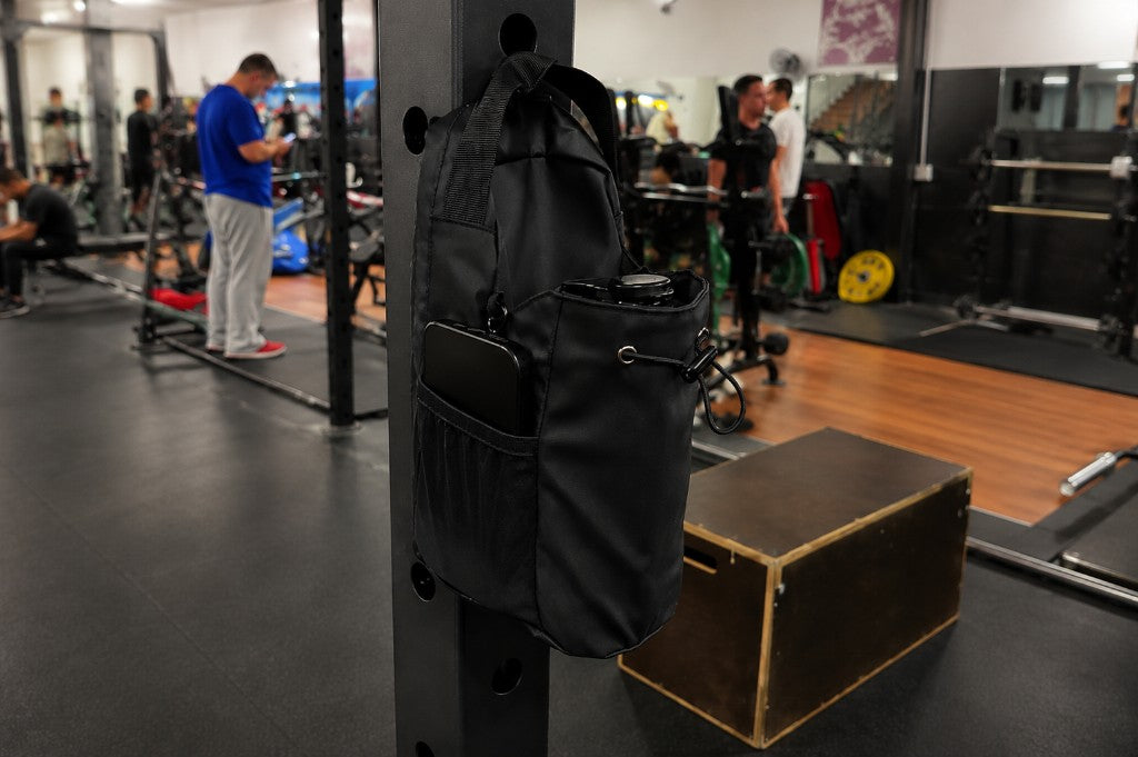 Magnetic gym bag hung on rack, off the gym floor